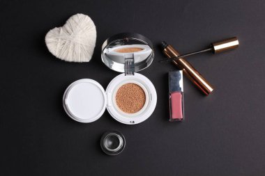 closeup view, cosmetics, makeup and beauty concept on dark background 
