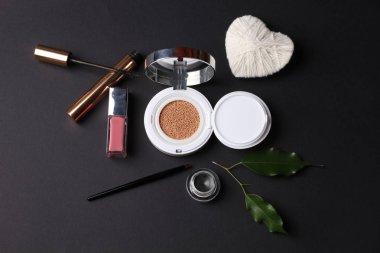 closeup view, cosmetics, makeup and beauty concept on dark background 