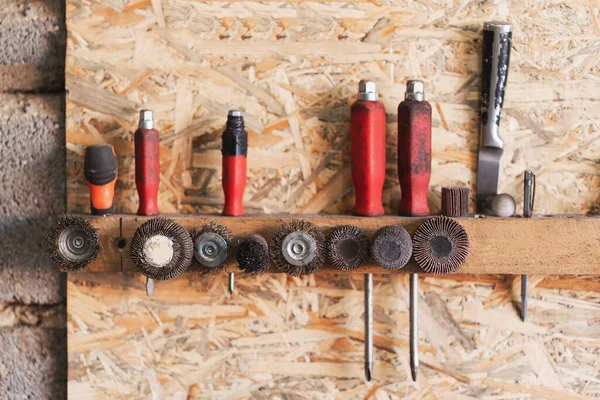 Various construction tools are hanging on the osb board Stock Picture