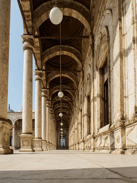 a look from below onto a typical arabic and beautiful decorated colonnade inside the patio of muhamad ali mosque in cairo