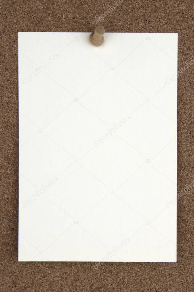 Cork board with tacks, white flash card
