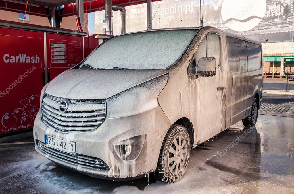 SZCZECIN, POLAND - FEBRUARY 14, 2017: Car washing cleaning with foam and hi pressured water.