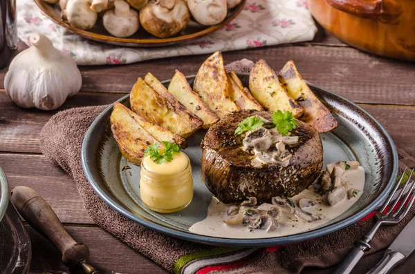 Steak with pepper sauce and mushrooms — Stock Photo, Image