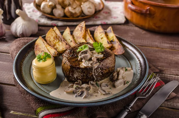 Steak with pepper sauce and mushrooms — Stock Photo, Image