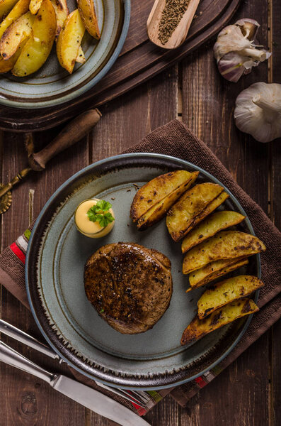 Steak with pepper sauce and mushrooms