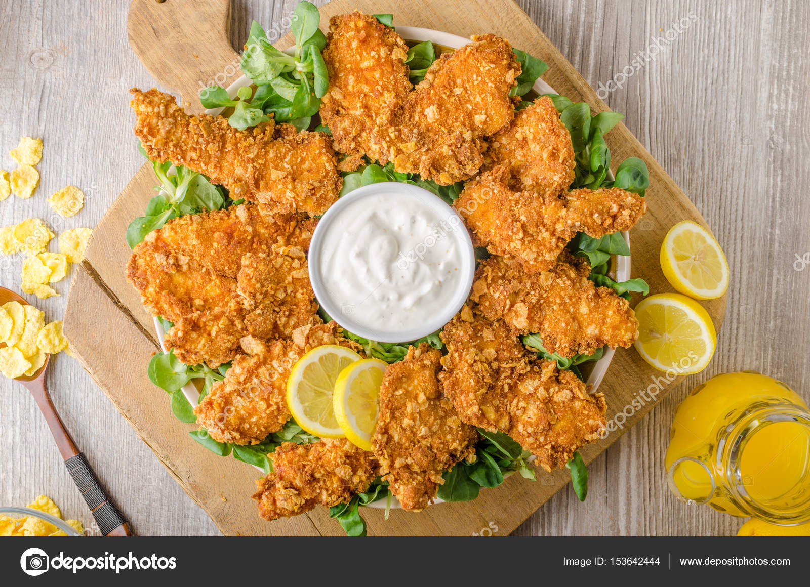 Chicken strips with delish garlic dip — Stock Photo © Peteer #153642444