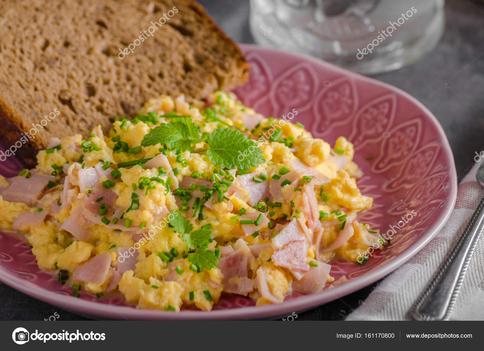 Scrambled eggs, wholegrain bread Stock Photo by ©Peteer 161170800