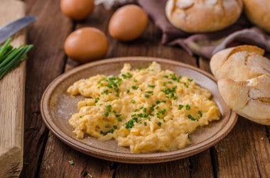 Scrambled eggs with herbs clipart