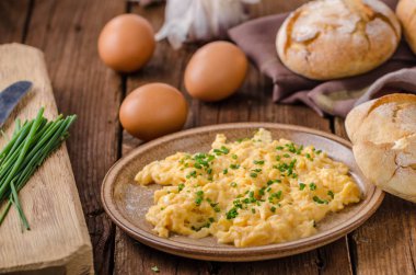 Scrambled eggs with herbs clipart