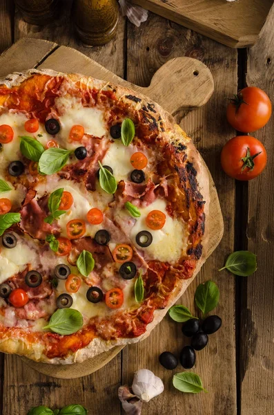 Rustic pizza with tomato, cheese, salami — Stock Photo, Image
