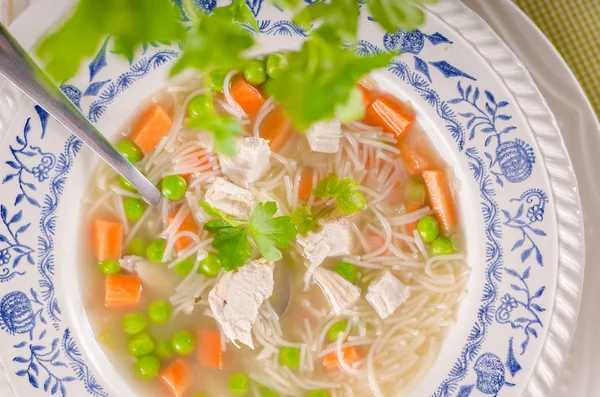 Spring chicken soup noodles, vegetable and toast — Stock Photo, Image