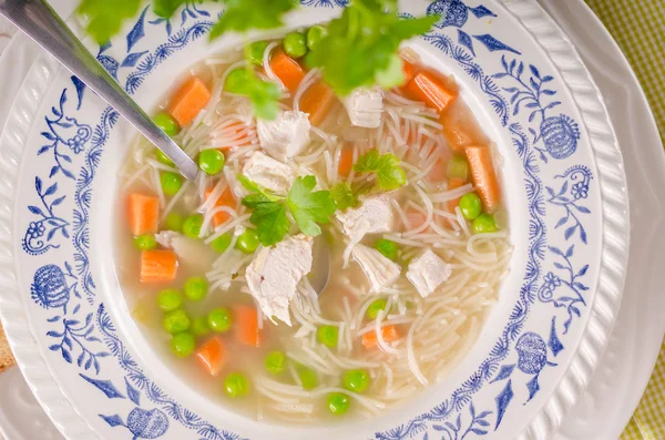 Spring chicken soup noodles, vegetable and toast — Stock Photo, Image