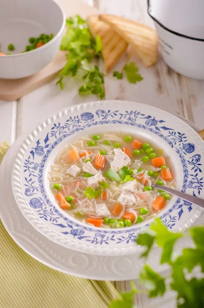 Spring chicken soup noodles, vegetable and toast — Stock Photo, Image