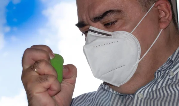 Year Old Squeezing Green Stress Ball One Hand Wearing Mask — Stock Photo, Image