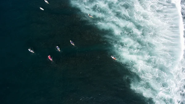 Group of surfers seek to the ocean — Stock Photo, Image