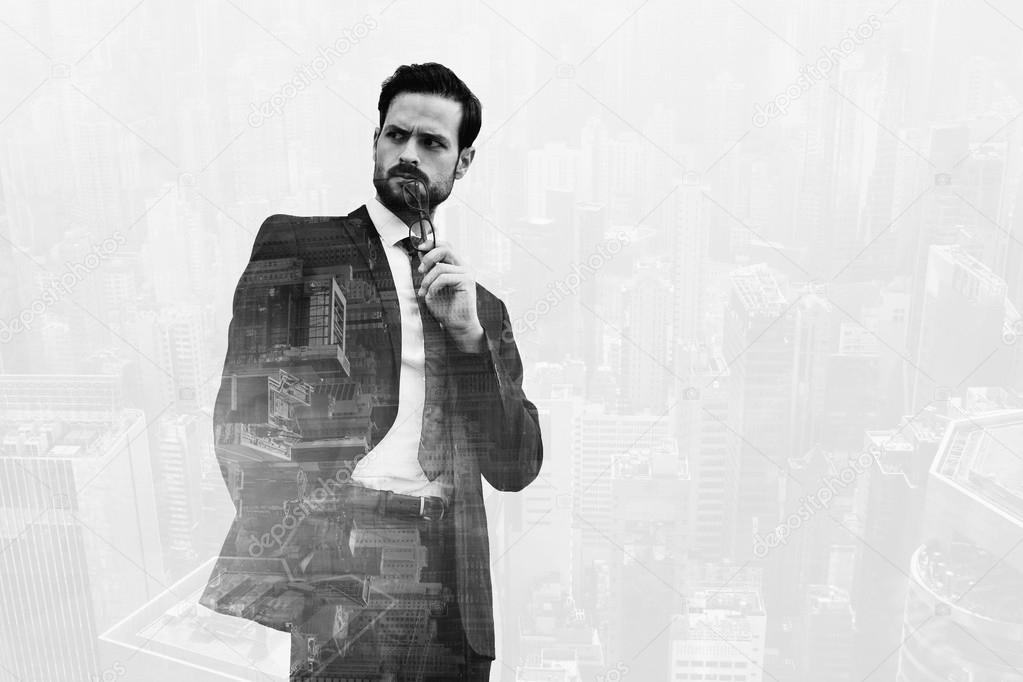 Double exposure with cityscape of business man holding glasses near mouth and looking on something with angry face