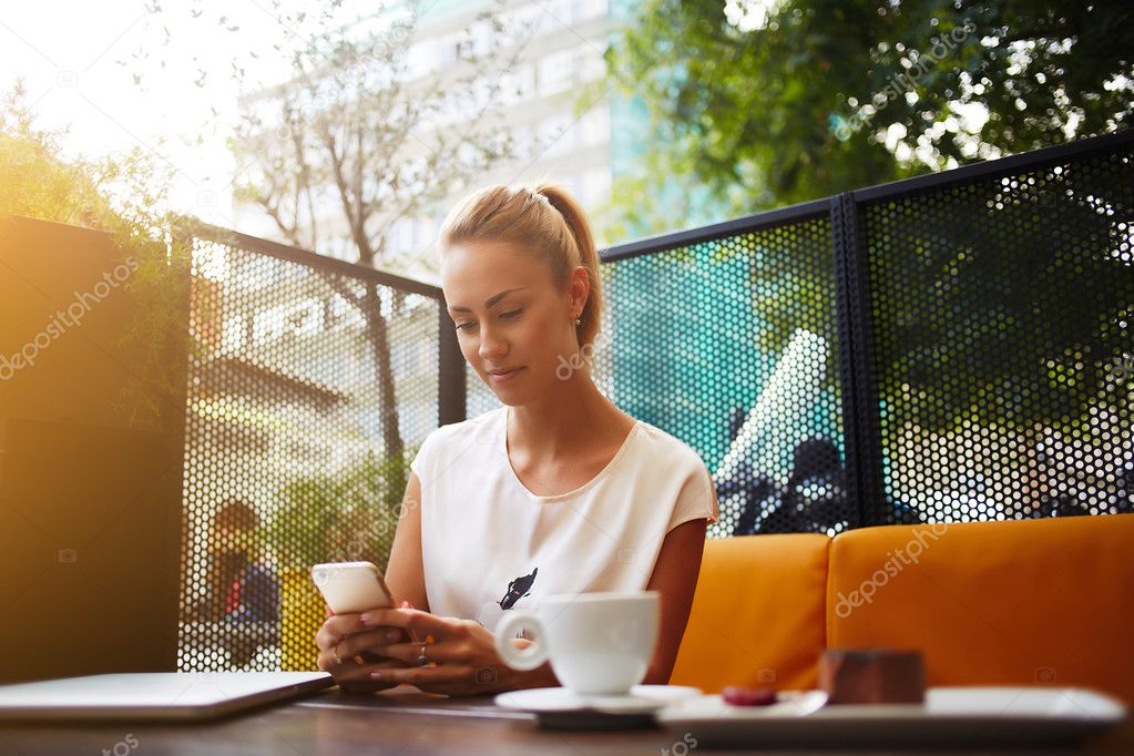 Young businesswoman is checking e-mail