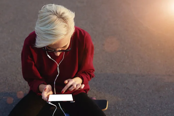 Hipster studentsitting near copy space for your advertising — Stock Photo, Image