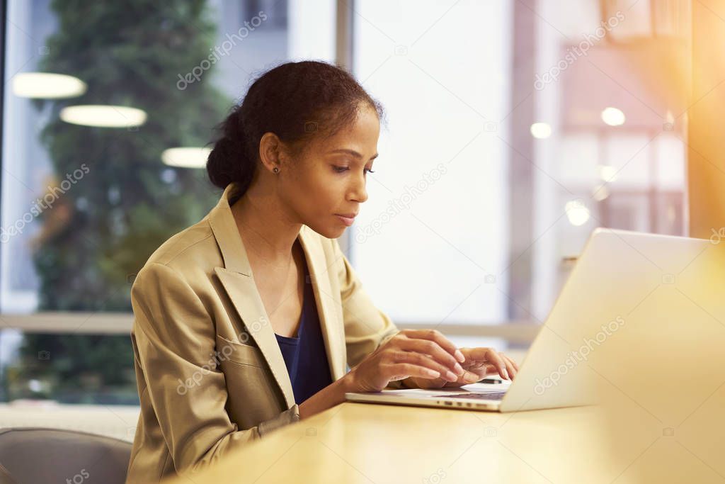 Editor reading articles on web page of modern online magazine