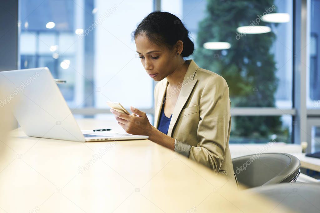 Leader of business corporation using wifi connection to network sitting near copy space for advertising