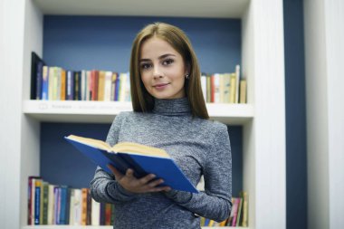 Student choosing textbooks for learning new information spending time in library clipart