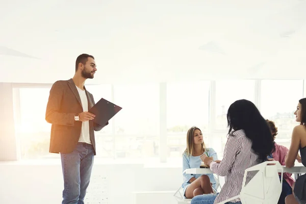 Talented male IT programmer making presentation of new software speaking about advantages and usability — Stock Photo, Image