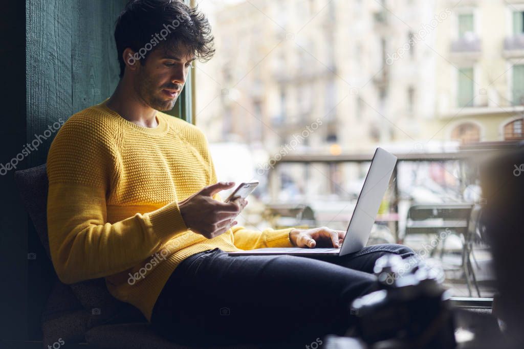 Stylish male freelancer working 