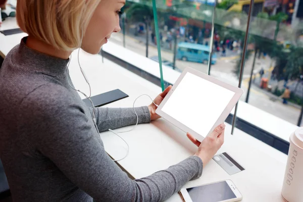 Attractive blonde female holding modern gadget — Stock Photo, Image