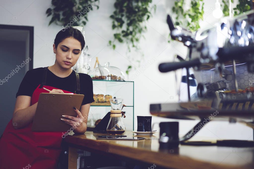 Manager of coffee shop making revisions