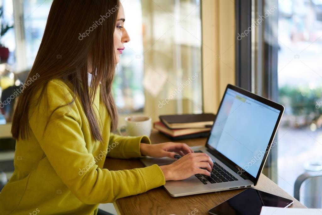 Female freelancer working on laptop  