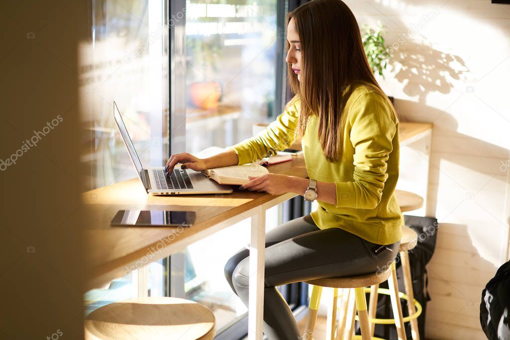 Female freelancer working on laptop  