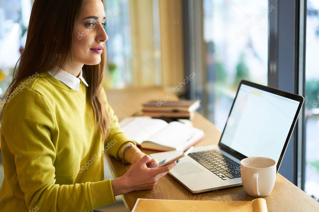 Attractive student working with laptop  