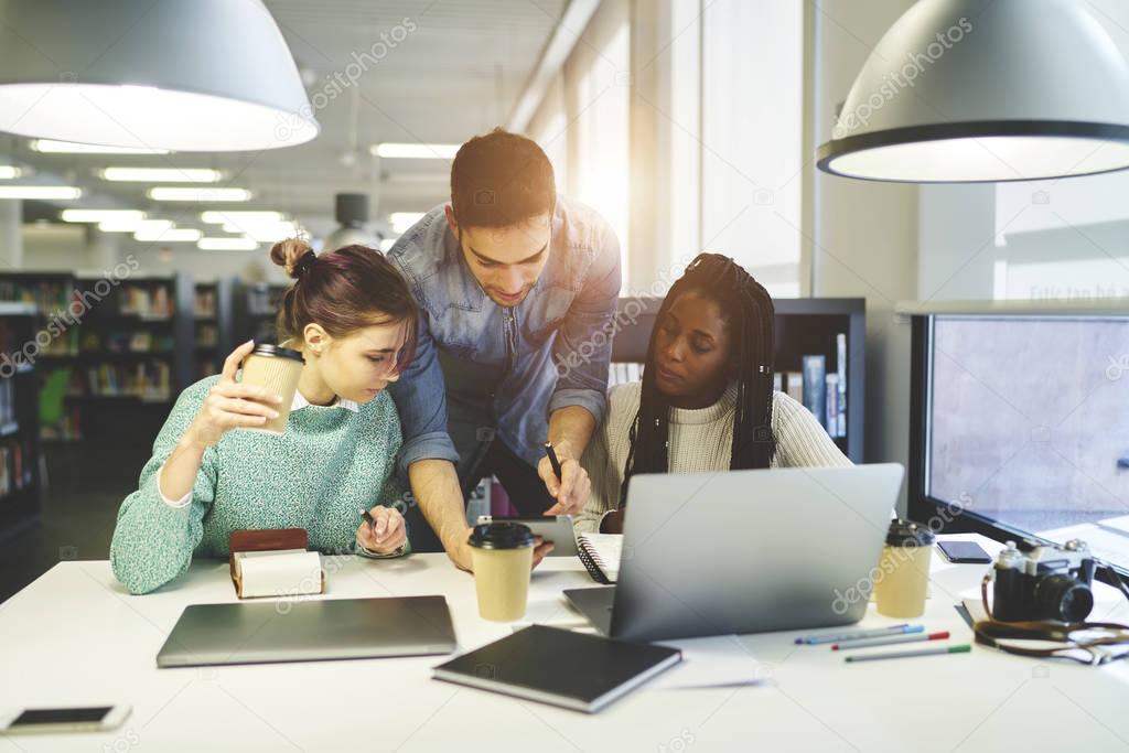 Multicultural coworkers working in workspace 