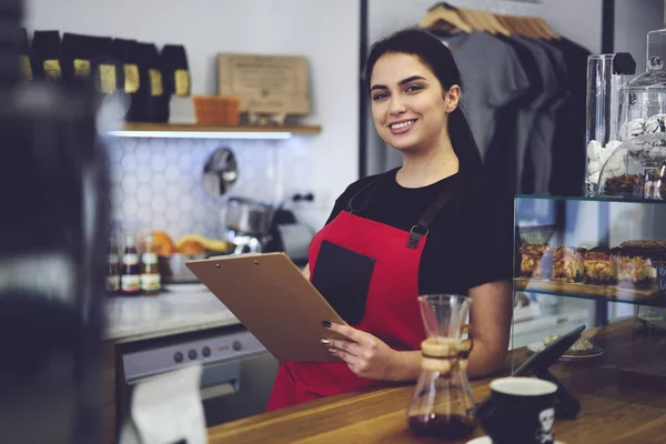 Smiling administrative manager counting annual income from service and sales — Stock Photo, Image