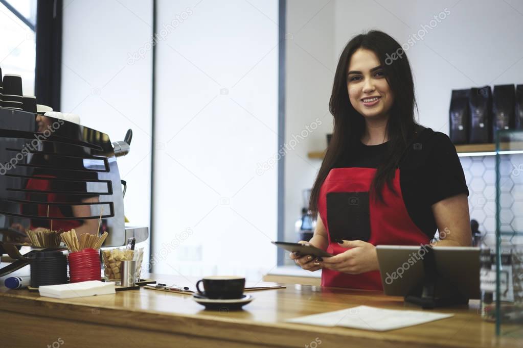 Orofessional female waitress making money transfer for purchasing