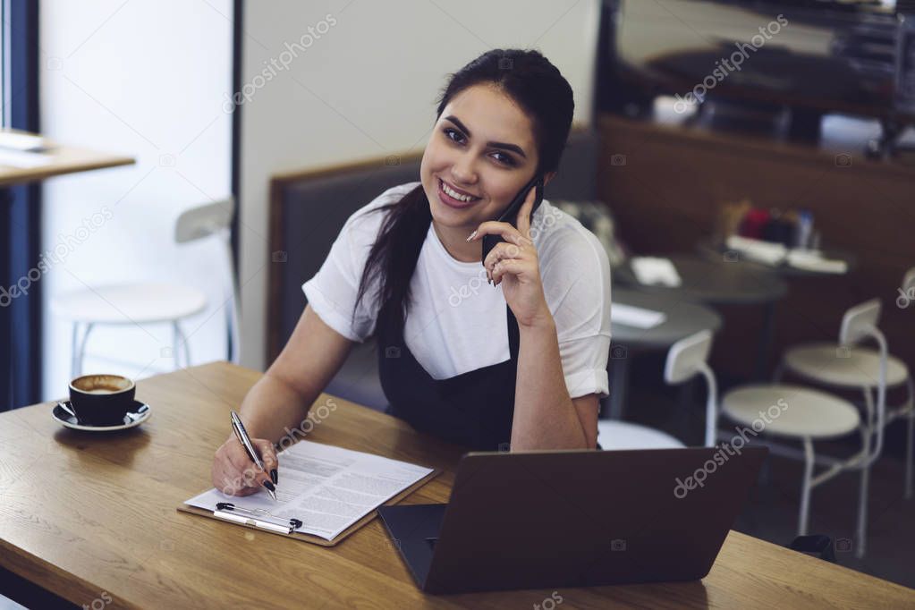 Female owner doing plan of work employers on next month
