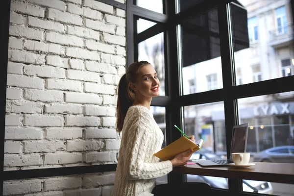 Smiling female journalist write notes for creating new article — Stock Photo, Image