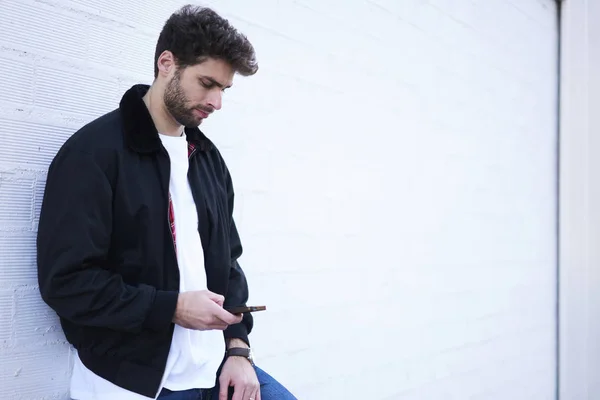 Caucasian young man search information on digital cellphone.Copy space for advertising — Stock Photo, Image