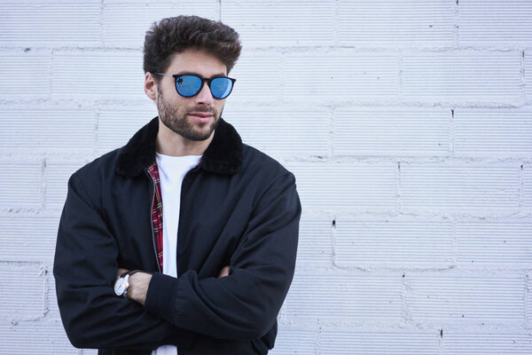 Fashionable hipster guy posing promotional spring fashion clothing content or advertising information