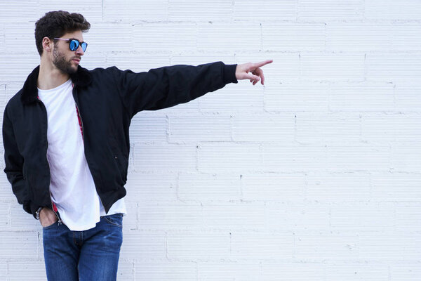 Trendy male model showing mock up background for promotion