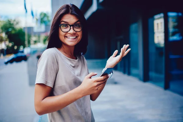 Portrait of cheerful business woman excited with reach success with startup receiving text message, charming positive student getting good job offer from prosperous corporation going for interview