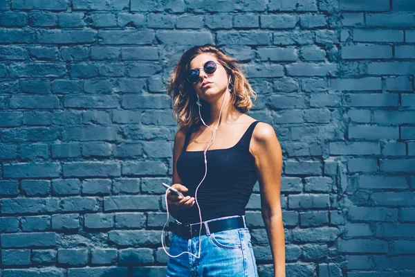 Attractive Female Sunglasses Enjoying Favorite Songs Earphones Using Mobile Application — Stock Photo, Image