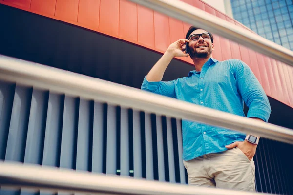 Cheerful Trendy Dressed Hipster Guy Having Mobile Conversation While Walking — Stock Photo, Image