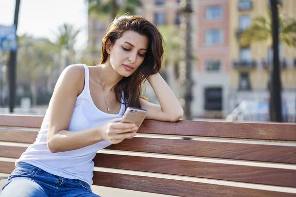 Thoughtful Young Woman Enjoying Sunny Day Sitting Bench Texting Messages — Stock Photo, Image