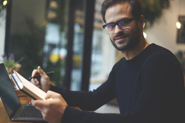 Portrait Bearded Entrepreneur Stylish Eyeglasses Holding Notepad Pen Hands Looking — Stock Photo, Image