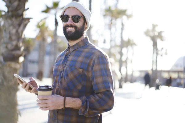 Portrait Smiling Hipster Guy Trendy Sunglasses Walk Outdoors Coffee Smartphone — Stock Photo, Image