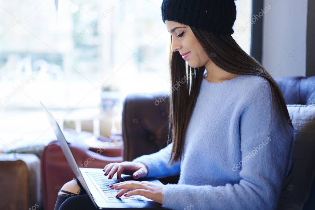Cropped image of concentrated graphic designer typing text message on keyboard to chatting online on modern digital computer connecting to wireless high speed internet.Promotional  background