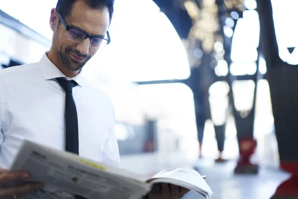 Pensive Male Entrepreneur Reading Newspaper Publications While Waiting Public Transport — Stock Photo, Image