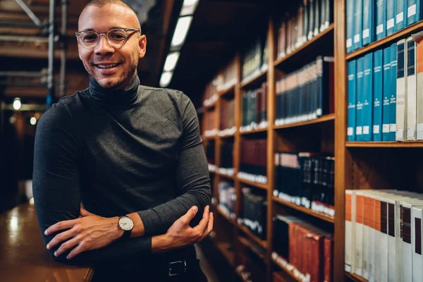 Portrait Cheerful Male Journalist Enjoying Time Public Library Standing Bookshelves — Stock Photo, Image