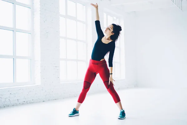 Attractive Brunette Female Doing Exercises Beginning Workout Stretching White Interior — Stock Photo, Image